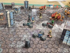 A shot of the middle line of the board, three objective towers visible in the middle.