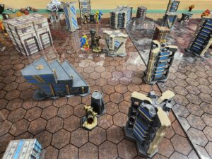 A shot of the opposing force zone in a Battletech map. In the distance, my Ostsol and a Crusader on one objective. Middle view: my Charger vs. my opponent's Hatchetman. Bottom: my Ostscout, unopposed.